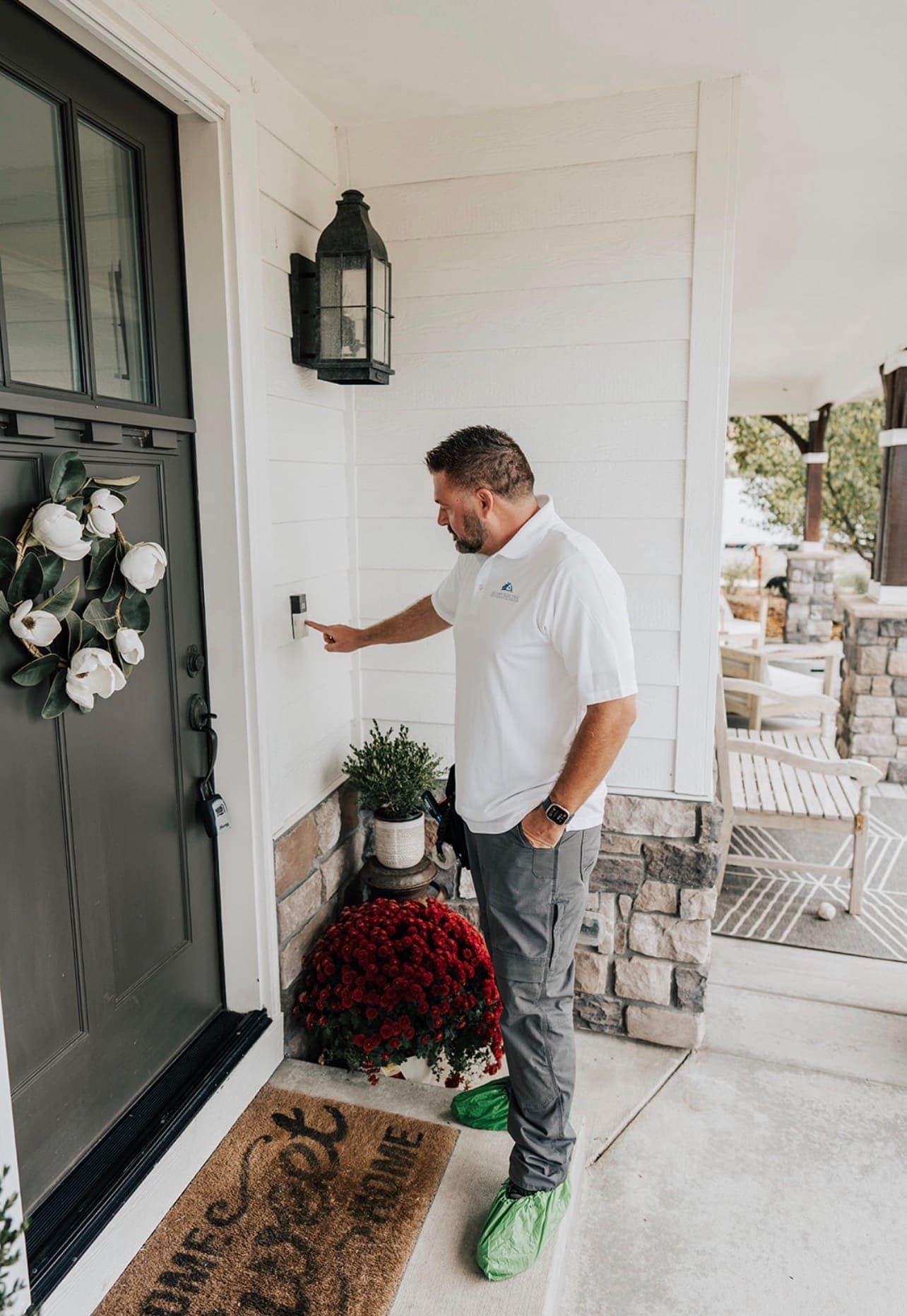 Testing a video doorbell at the front door of a Parker home