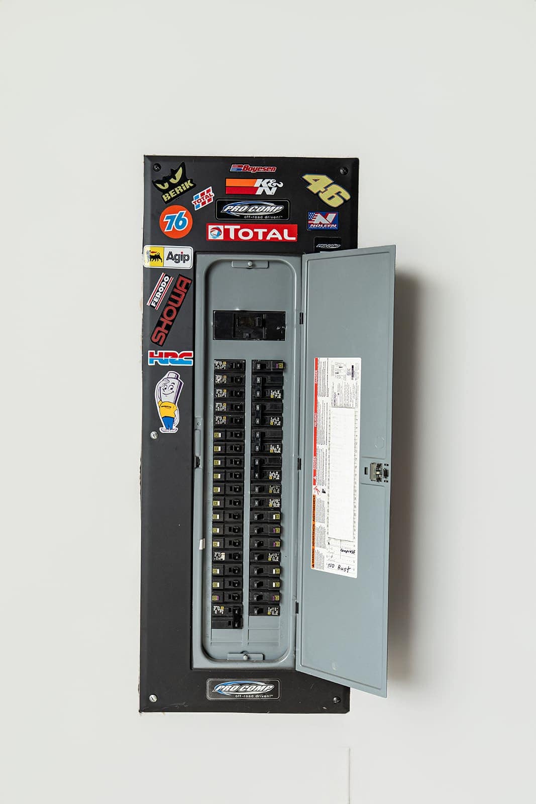 A residential breaker panel with the cover off during service work